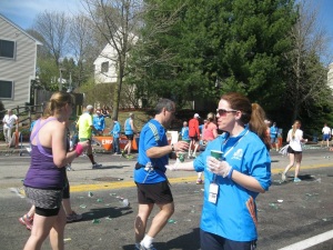 Handing out water at Mile 16.  My shoulder is killing me! 